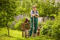 Garden gardener spade straw hat standing dog
