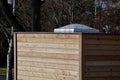 Garden gazebo, pavilion or toilets in the park made of modern wood paneling building envelope the size of a construction container