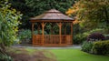 Garden gazebo with wooden architecture surrounded by lush greenery in park setting Royalty Free Stock Photo