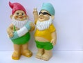 Two funny garden gnomes with swimming ring and sunglasses