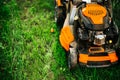 Grass maintenance details - close up view of grass mower, lawnmower details Royalty Free Stock Photo