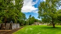 Garden with green grass, trees and a path in the Abbey Graveyard in the village of Athlone