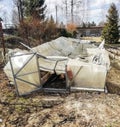 Garden greenhouse destroyed by snow made of transparent polycarbonate