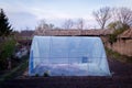 Garden greenhouse with metal frame Royalty Free Stock Photo