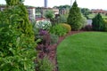 Garden with group of ornamental colourfull shrubs perennials and conifers Royalty Free Stock Photo