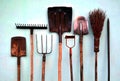 Garden hand tools stand against the wall Royalty Free Stock Photo