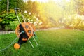 Garden hose reel on green lawn in backyard Royalty Free Stock Photo