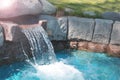 Garden and landscaping. artificial waterfall on the home lawn. Royalty Free Stock Photo