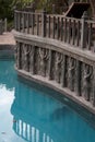 Garden lounge pool with stone sculptures and pilasters