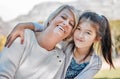 A garden of love grows in a grandmothers heart. Portrait of a little girl bonding with her grandmother outdoors.