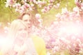 Garden with magnolia flower in spring, summer, man and woman Royalty Free Stock Photo