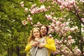 Garden with magnolia flower in spring, summer, man and woman Royalty Free Stock Photo