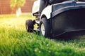 Garden maintenance - close up view of grass mower Royalty Free Stock Photo