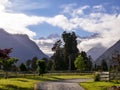 Garden with mountain, cloud and blue sky in the background Royalty Free Stock Photo