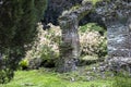 Garden of Ninfa in Italy in province of Latina and the arch of one ruined construction of the medieval city Ninfa.