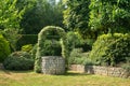 Garden with Old Water Well With Pulley and Bucket Royalty Free Stock Photo