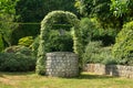 Garden with Old Water Well With Pulley and Bucket Royalty Free Stock Photo