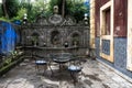 Garden with outdoor seating and decorative azulejos wall in Lisbon, Portugal