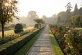 Garden Path Through Formal Garden in the Morning Light Royalty Free Stock Photo