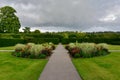 Garden Path with a Lawn and Flower Bed Royalty Free Stock Photo