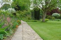 Garden Path with a Lawn and Flower Bed Royalty Free Stock Photo