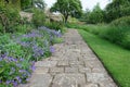 Garden Path with a Lawn and Flower Bed Royalty Free Stock Photo