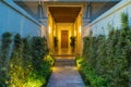 Garden path in resort with warm light and trees on side at evening, Garden Decoration Royalty Free Stock Photo