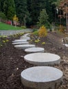 Garden paths made of circular stone slabs
