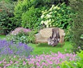 Garden of peace paradise chaise lounge longue gardens cat pets pet animals eden peaceful chair seat bench Royalty Free Stock Photo