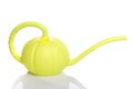 Garden plastic watering can in the shape of a pumpkin with a handle for watering plants on a white isolated background Royalty Free Stock Photo