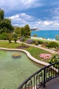 Garden with pond near sea Royalty Free Stock Photo