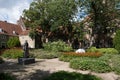 Garden of the Prinsenhof museum in Delft with statue of William of Orange