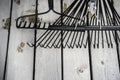 Garden Rakes on wood decking in a residential home