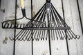 Garden Rakes on wood decking in a residential home