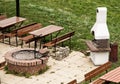 Garden restaurant with the stone grill Royalty Free Stock Photo