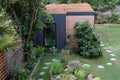 Garden room, green retreat with bee friendly, living sedum roof in well stocked, mature garden.