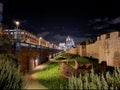 Garden between royal jail and Ower Bridge during a winter night with lots of lights