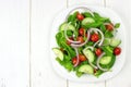 Garden salad on plate with white wood background Royalty Free Stock Photo