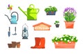 Garden set of lavender, strawberry in pots, watering can, red rubber boots, lamp, wooden sing and tools for gardening