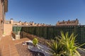 Garden of a single-family home with metal fence and outdoor plants