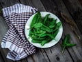 Garden sorrel in a bowl on wooden table. Style rustic. . Royalty Free Stock Photo