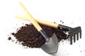 garden spade and a rake on peat soil separately on a white background