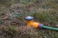 Garden sprinkler on dead lawn Royalty Free Stock Photo