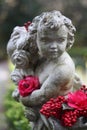 Garden Statue with Colorful Flowers
