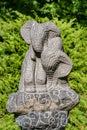 Garden statue of two small elephants made of stone