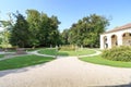 Garden with statues and water well at Villa Widmann in Riviera del Brenta, Italy