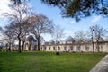 Garden of the Suleymaniye Mosque. Some of the tourists visiting the mosque are resting in the garden