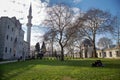 Garden of the Suleymaniye Mosque. Some of the tourists visiting the mosque are resting in the garden