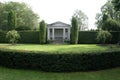 Garden with a summerhouse and topiary