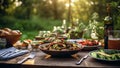 Garden table filled with food, bbq,summer food table.Table filled with drinks and food outside in the garden under the